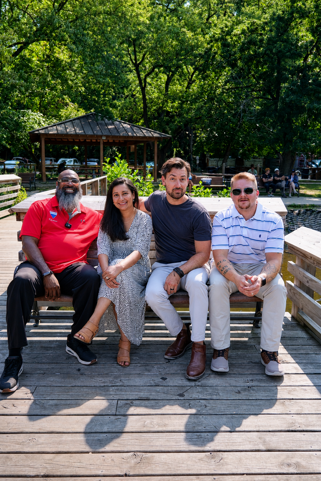 RE/MAX Platinum Ann Arbor team seated at Argo Park along the Huron River in Ann Arbor, Michigan